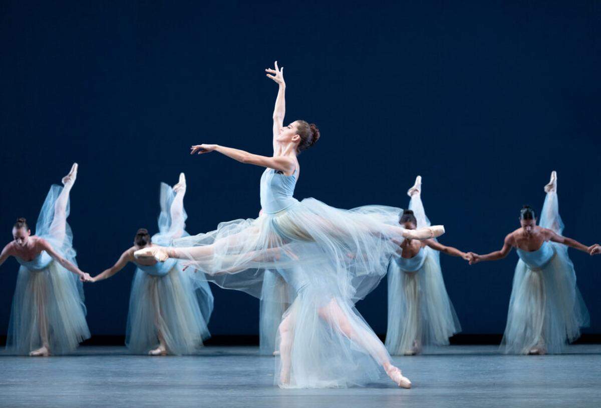 Taylor Naturkas leaping toward an other-worldly sphere in George Balanchine’s “Serenade.” Choreography by George Balanchine, The George Balanchine Trust.