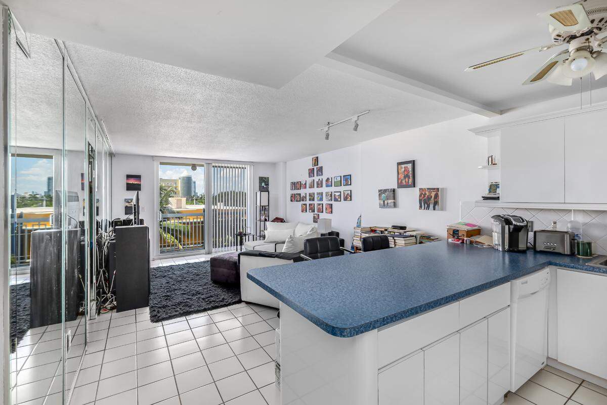 Step inside this South Beach apartment going for $2,900 a month. After entering the front door, renters see the kitchen to their right and the living room with views overlooking Ocean Drive.