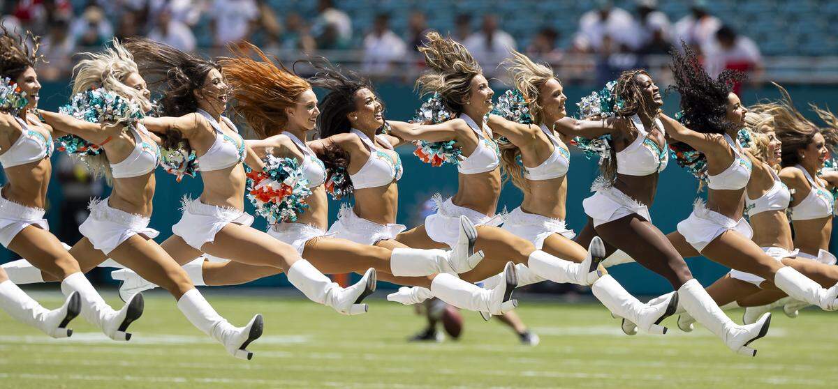 Miami Dolphins cheerleaders perform as their team prepares to play against the New England Patriots in their NFL game at Hard Rock Stadium on Sunday, Sept. 14, 2025, in Miami Gardens, Fla.