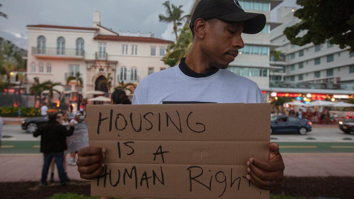 Armen Henderson holds a sign during a protest calling for better treatment of homeless people in Miami Beach on Saturday August 3rd, 2024.