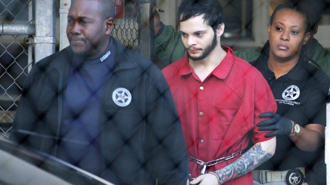 In this Jan. 30, 2017, file photo, Esteban Santiago, center, is led from the Broward County jail for an arraignment in federal court in Fort Lauderdale.