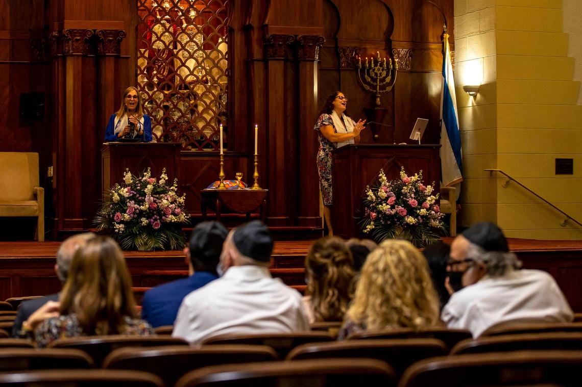 Senior Rabbi Amy L. Morrison, right, and Cantor Rachelle Nelson, left, sing in unison while praying during a service inside Temple Israel of Greater Miami on March 11, 2022.