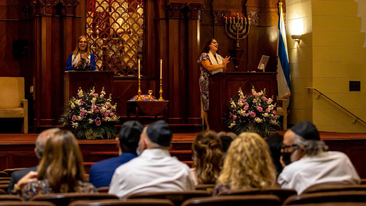 Temple Israel of Greater Miami, one of South Florida’s oldest Jewish synagogues, is planning to move out of its current synagogue by summer 2025. Photographed here in 2022 is then-Rabbi Amy L. Morrison, right, and Cantor Rachelle Nelson, left, singing during service inside the temple.