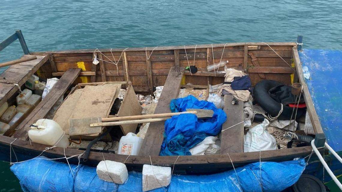 A makeshift wooden boat floats off Boot Key Harbor in the Florida Keys on Wednesday, Sept. 22, 2021. The Coast Guard said 16 people from Cuba trying to migrate to the United States were on board the vessel.