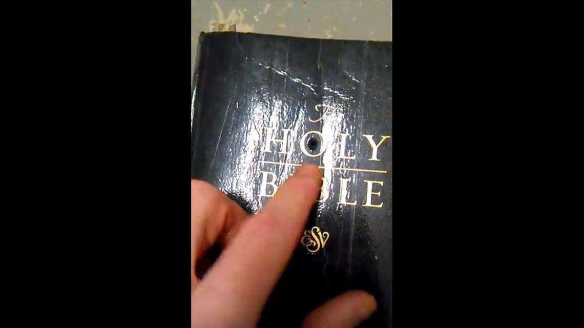 Scott Whitney concealed a camera inside his Bible. He used it to record life inside Martin Correctional Institution. The lens peeked through a hole inside the letter O in the word Holy.