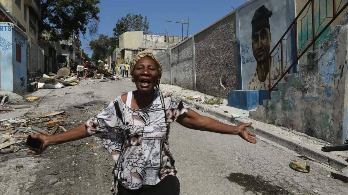 File photo: Rose Marie Michel, 73, finds that gangs have flattened her home in Delmas 30 after she visits to see if she can return. She has lived in the Port-au-Prince neighborhood since 1974.