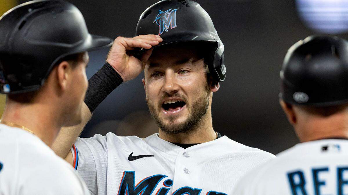 Miami Marlins base runner Garrett Hampson (1) speaks with teammate Nick Fortes (4) during the seventh inning of an MLB game against the Washington Nationals at loanDepot park in the Little Havana neighborhood of Miami, Florida, on Tuesday, May 16, 2023.