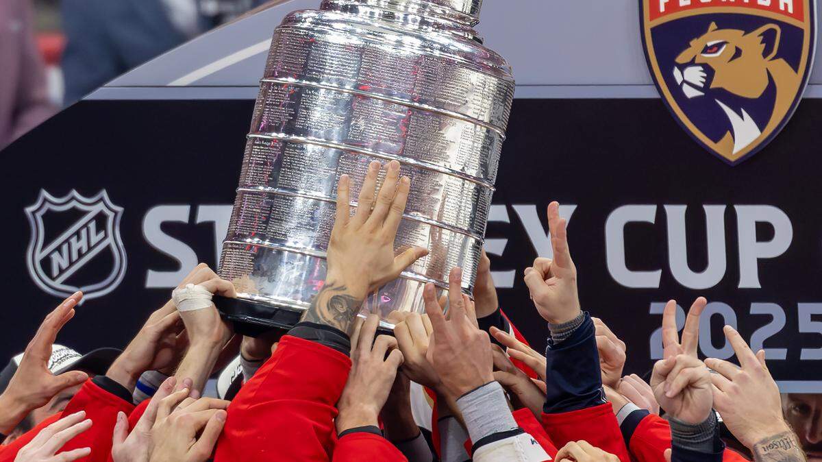Florida Panthers players hoist the Stanley Cup after a 5-1 win over the Edmonton Oilers in Game 6 of the Stanley Cup Final at Amerant Bank Arena on Tuesday, June 17, 2025, in Sunrise, Fla., securing the NHL championship.