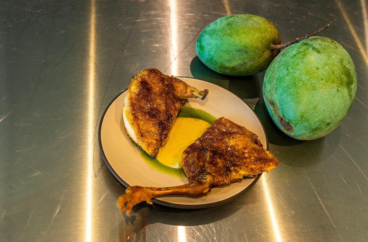 Pennsylvania Golden Chicken served with green mango sauce, hoja Santa and Florida red potatoes is one of the specialties at Recoveco.