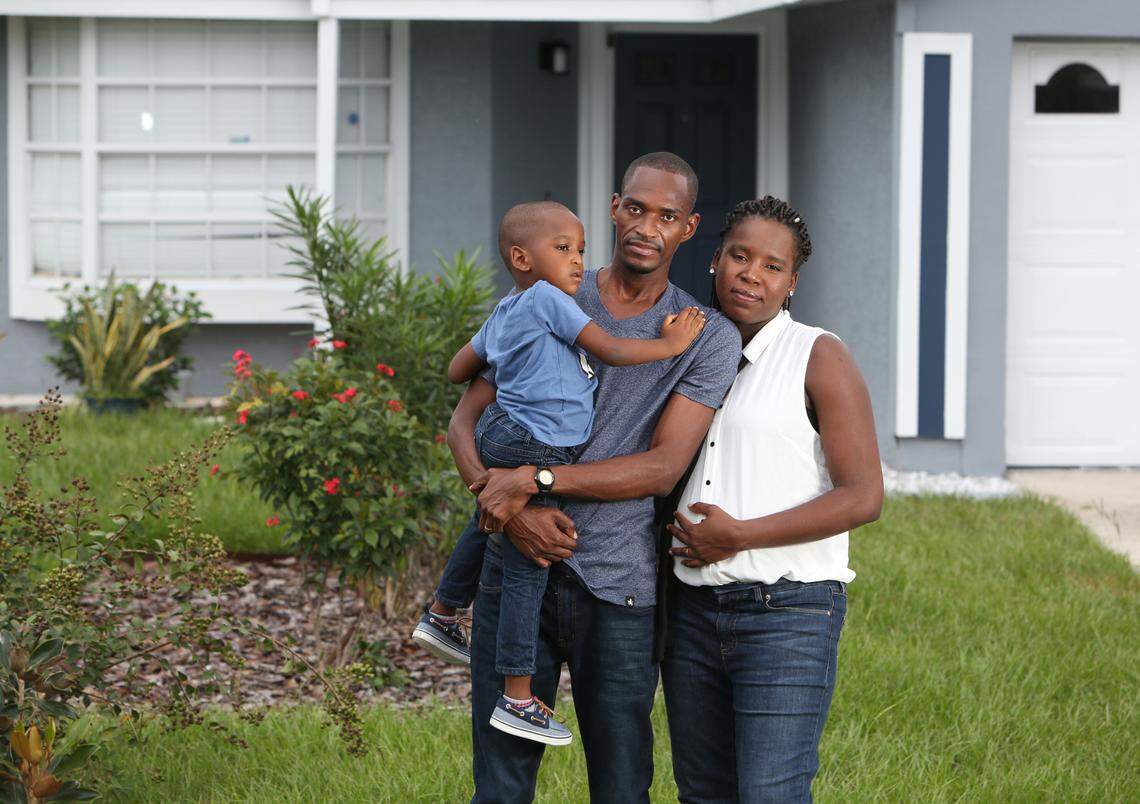 Ruth and Jean Jacques with their son Raphael, who will never know his older brother Reggie.