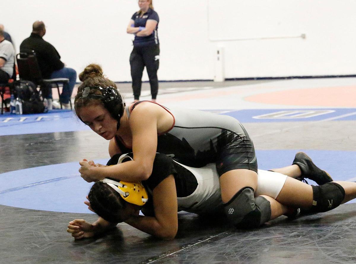 Stoneman Douglas’ Gabriela Caro wrestles Nova’s Nayara Stubna during the 130-pound BCAA wrestling championship on Saturday, February 3, 2024 at Pompano Beach High.