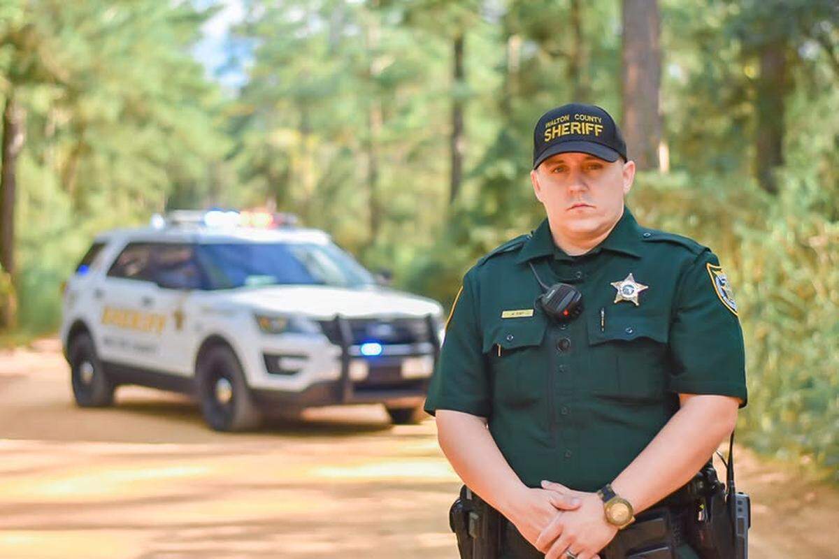 Despite being hit multiple times, Deputy Will May managed to return fire, killing the shooter, Walton County officials said at a news conference.