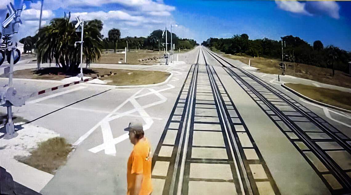 This still image taken from a Brightline train cam shows Randy Johanson, 62, shortly before the train struck him on April 18, 2024. He had made it across the tracks, but trains are wider than the rails by about three feet on each side.