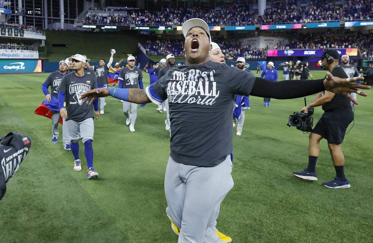 Venezuela catcher Salvador Perez (13) celebrates with teammates after defeating the United States during the final game of the 2026 World Baseball Classic at loanDepot park on Tuesday, March 17, 2026.