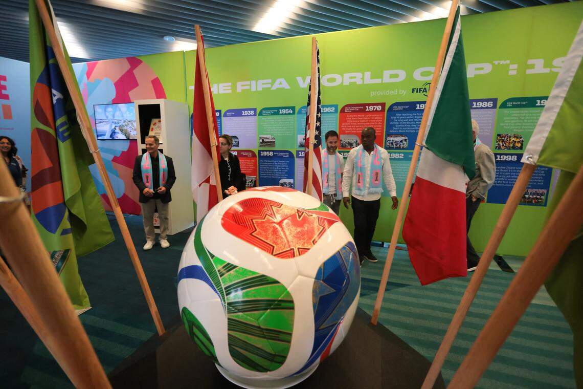 Colombian former soccer player Luis Carlos Perea and Argentinian former soccer player Juan Manuel "Burrito" Martínez walk inside Miami's volunteer center for the 2026 FIFA World Cup during its grand opening at Brightline MiamiCentral in downtown at 350 NW 1st Ave. on Monday, Dec. 8, 2025, in Miami, Fla. The center will serve as the hub for training, uniform distribution, orientation, and deployment of volunteers.
