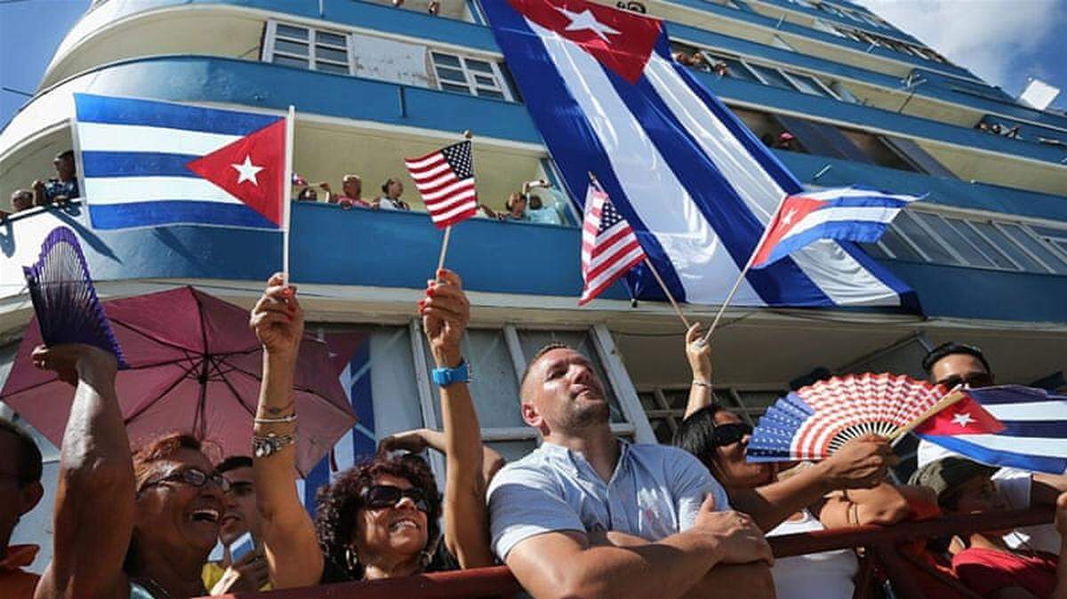Cubans and foreign visitors in Havana, Cuba, attend the flag-raising ceremony for the newly reopened U.S. embassy in 2015.