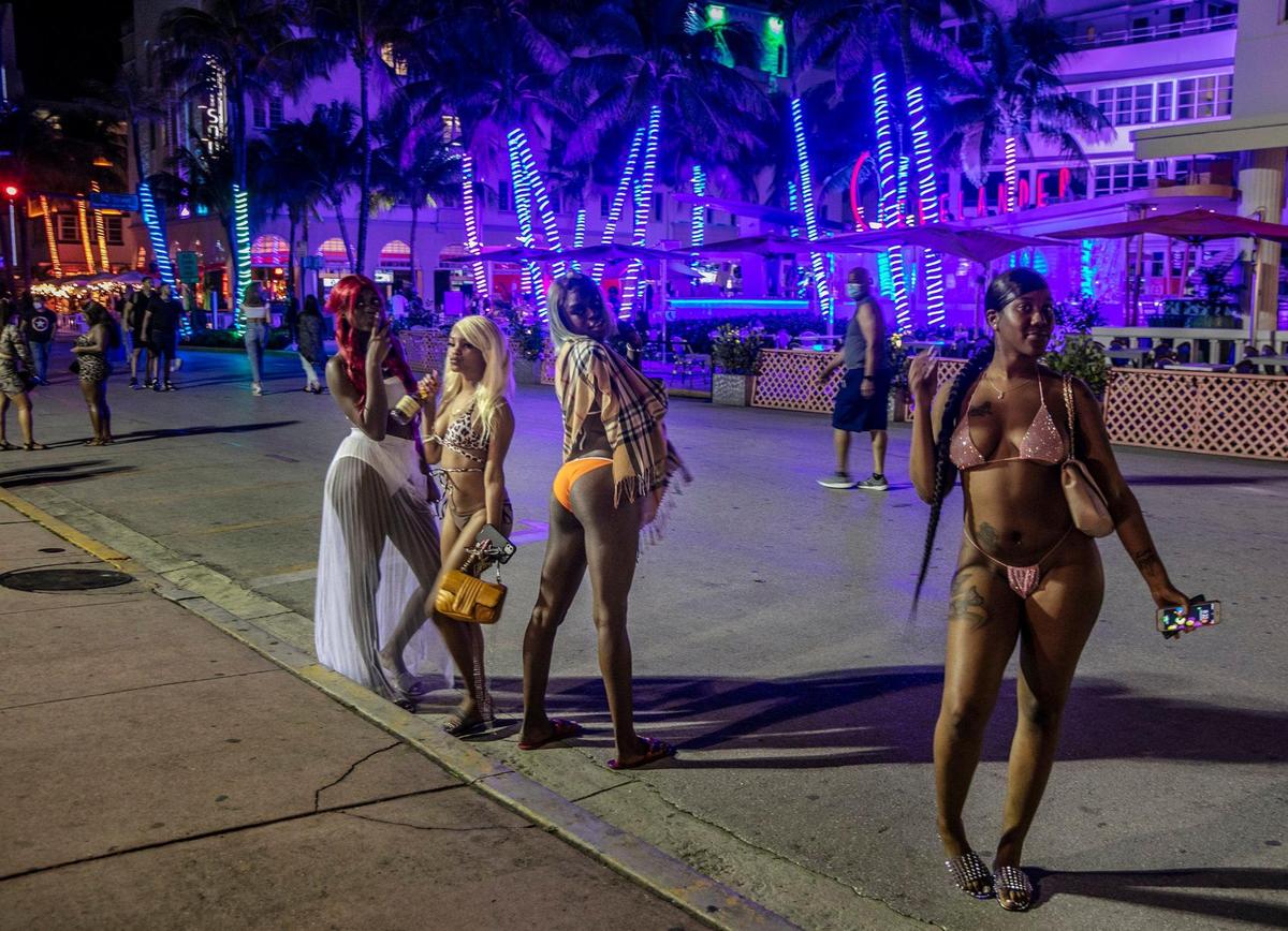 A group of tourists are seen by the Clevelander on Ocean Drive as spring break continues in South Beach with a smaller crowd in the streets than previous days, on Wednesday, March 24, 2021.