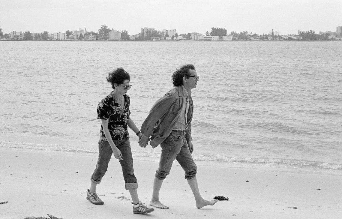 Artrist Christo and his wife, Jeanne-Claude, walk along an island beach in Biscayne Bay during 'Surrounded Islands.'