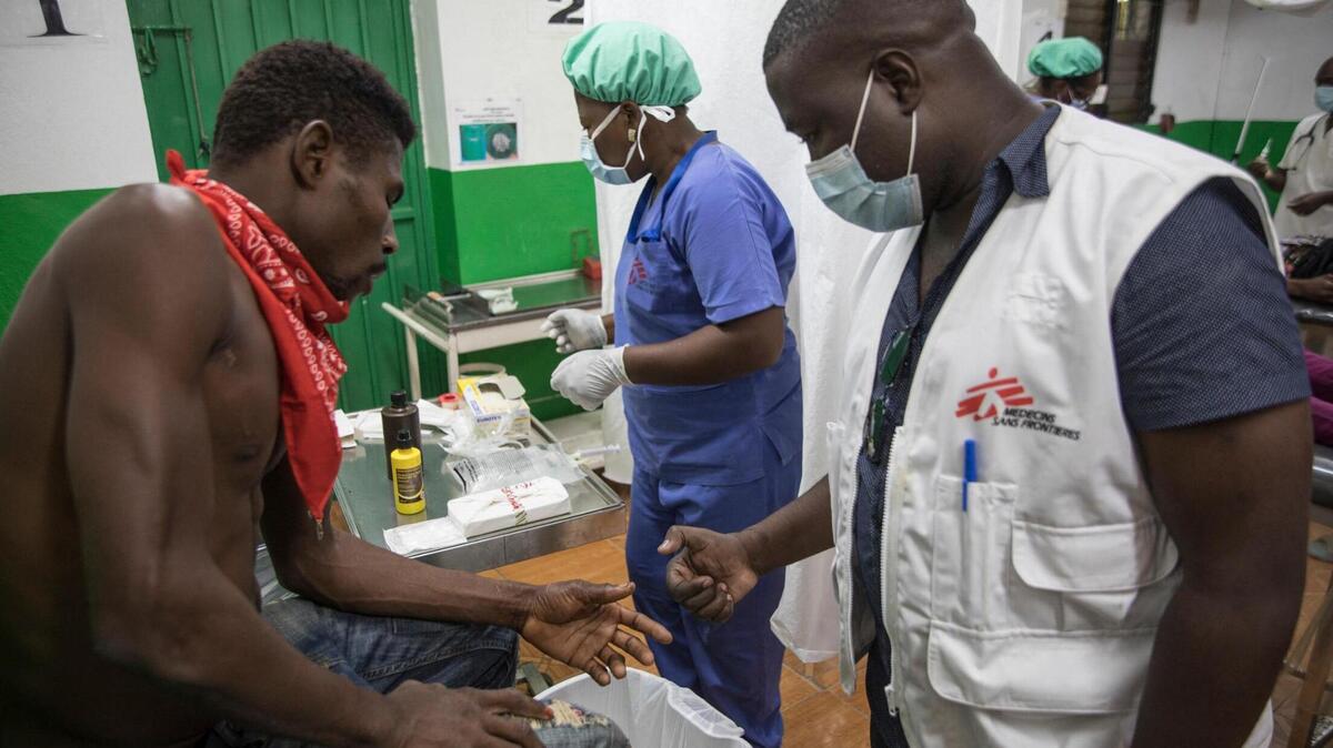 A Doctors Without Borders/Médecins Sans Frontières (MSF) medical worker takes care of a patient in the emergency room at the Martissant Hospital, in Martissant, Haiti, on May 31, 2021.