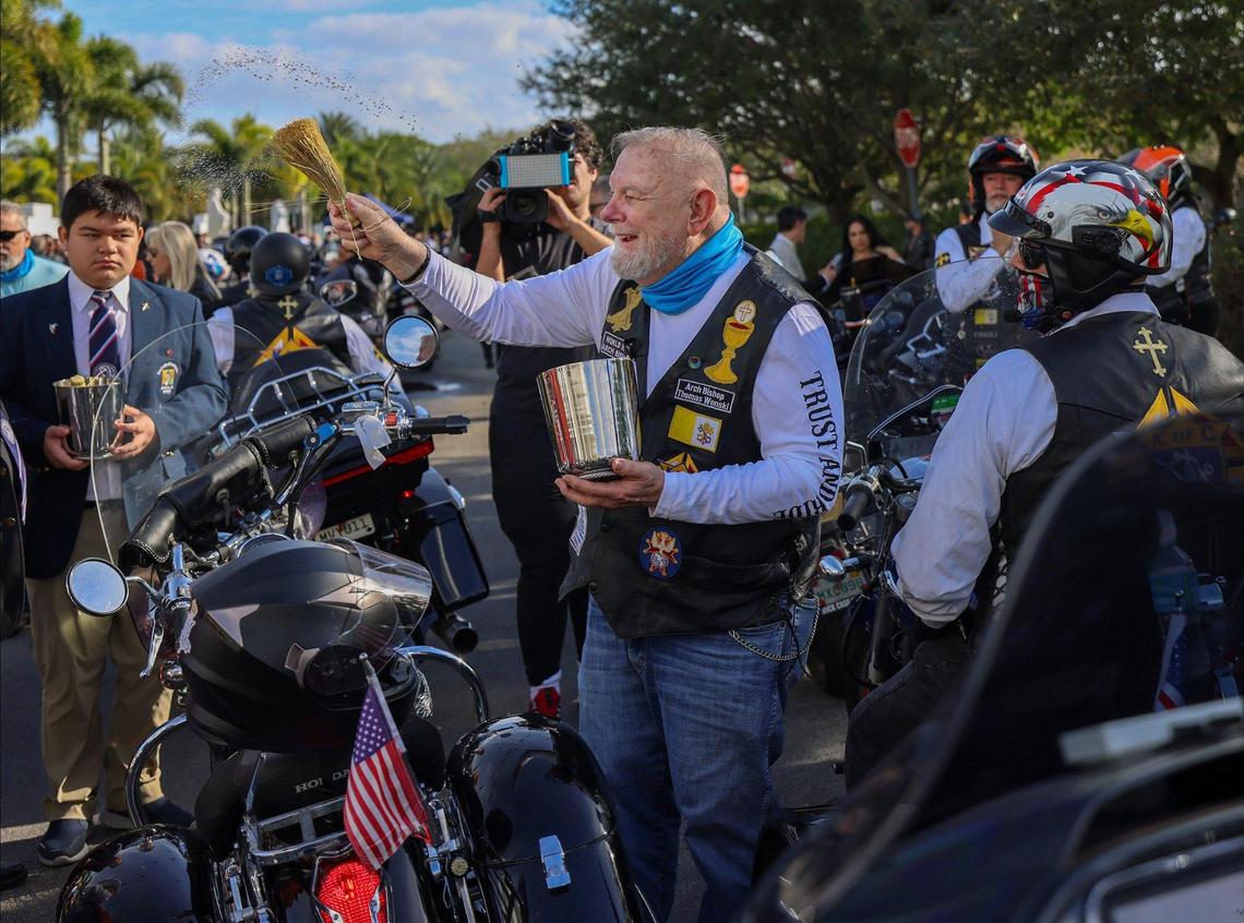 Archbishop Thomas Gerard Wenski, center, blesses some of the approximately 350 riders who took part in the 13th Annual Archbishop Motorcycle Ride. The event benefits the St. Luke’s Center, an alcohol and drug rehabilitation facility in Miami.