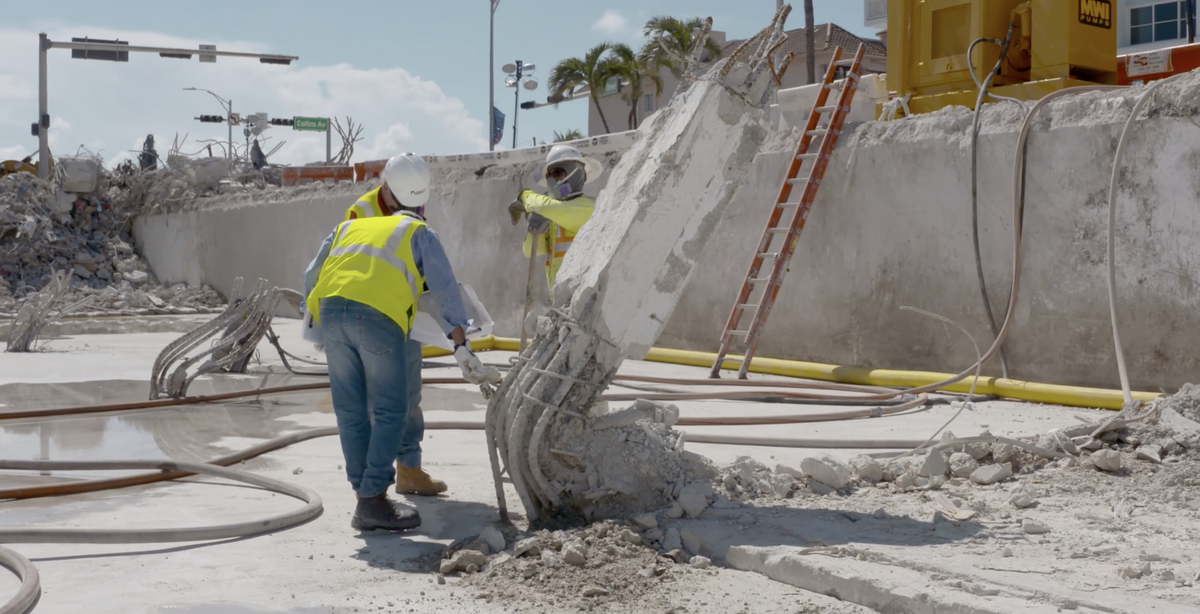 In a video published Aug. 25 by the National Institute of Standards and Technology, a team examines the rebar at the base of a buckled column in Champlain Towers South.