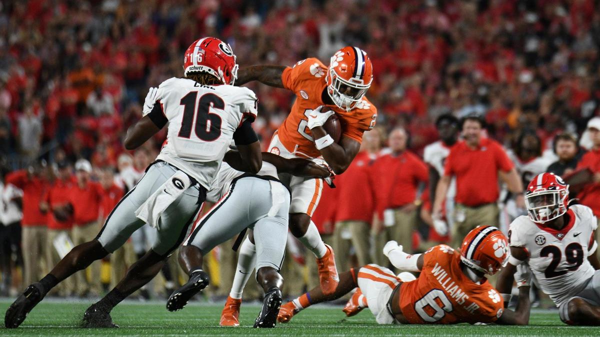 CHARLOTTE, NC - SEPTEMBER 04: Clemson Tigers wide receiver Frank Ladson Jr. (2) dodges a tackle after a catch during the game between the Clemson Tigers and the Georgia Bulldogs on September 4, 2021 at Bank of America Stadium in Charlotte, NC. (Photo by William Howard/Icon Sportswire) (Icon Sportswire via AP Images)