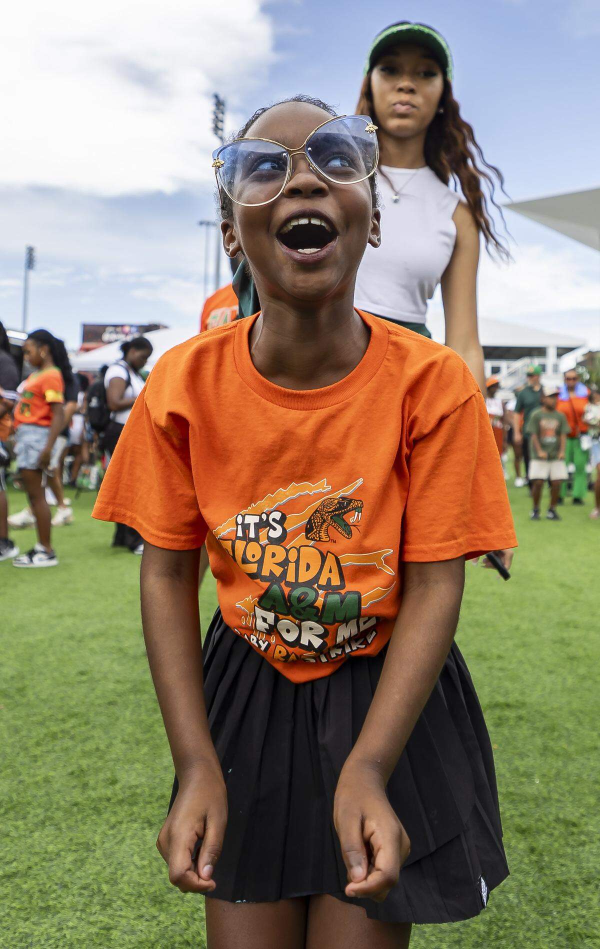 Laila Mathis, 9, dances during a fan festival before the Orange Blossom Classic football game between the Florida A&M Rattlers and the Howard Bison at Hard Rock Stadium on Saturday, Aug. 30, 2025, in Miami Gardens, Fla.