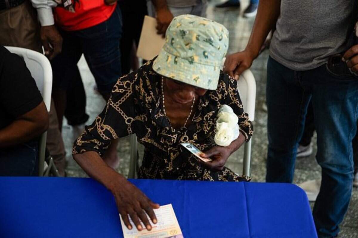 Haitians register to vote in the upcoming general election, in Port-au-Prince, Haiti, on July 31, 2026. Haiti's electoral council on July 27, 2026, set December 13 as the date for the crisis-wracked nation's first elections in a decade, pending the establishment of an "acceptable security environment." Elections have not been held in Haiti since 2016, and the country's last elected president, Jovenel Moise, was assassinated in 2021. (Photo by Clarens SIFFROY / AFP via Getty Images)