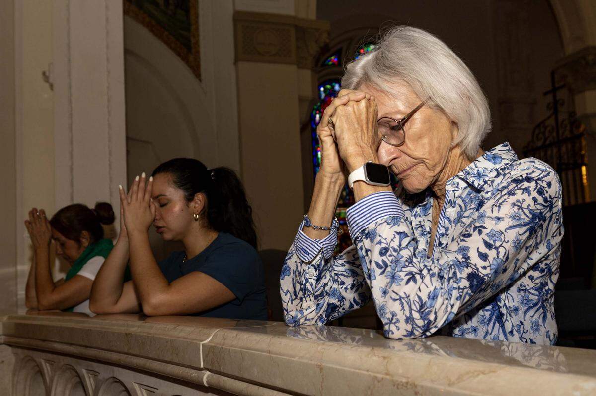 Congregants pray inside Trinity Episcopal Cathedral during Vox Dei, a new interactive service of Holy Eucharist, on Sunday, September 7, 2025, in Miami, Fla. Trinity Episcopal Cathedral is celebrating the centennial anniversary of the church.