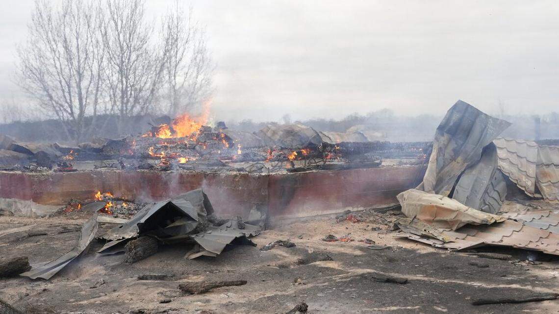 Smoke and flames rise from the debris of a privet house in the aftermath of Russian shelling outside Kyiv, Ukraine, Thursday, Feb. 24, 2022. Russia on Thursday unleashed a barrage of air and missile strikes on Ukrainian facilities across the country.