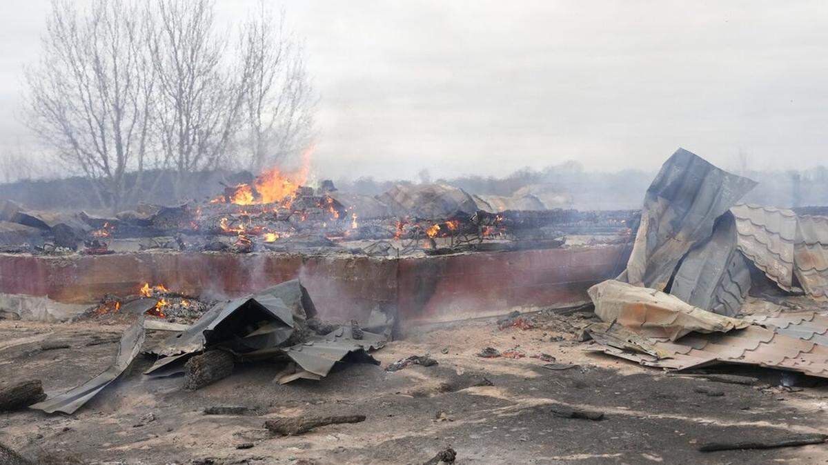 Smoke and flames rise from the debris of a privet house in the aftermath of Russian shelling outside Kyiv, Ukraine, Thursday, Feb. 24, 2022. Russia on Thursday unleashed a barrage of air and missile strikes on Ukrainian facilities across the country.
