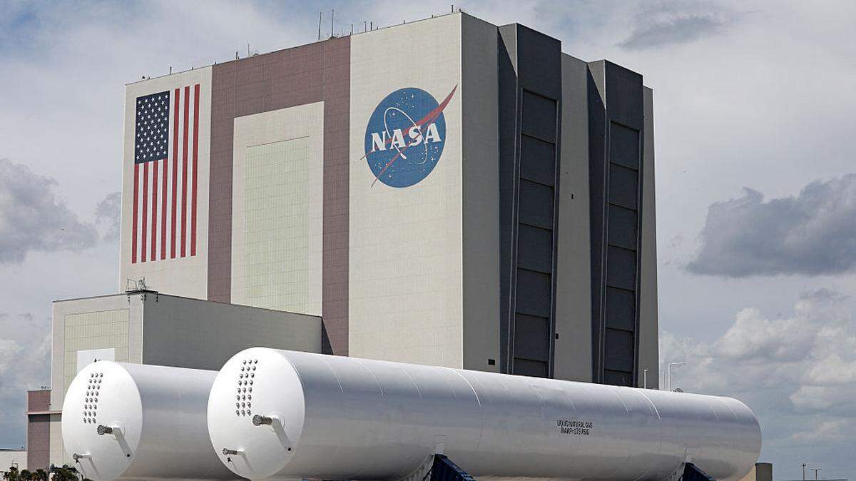A pair of large liquid natural gas tanks are seen in a parking lot near the Turning Basin at the Kennedy Space Center in Cape Canaveral, Florida, on Thursday, March 12, 2026.