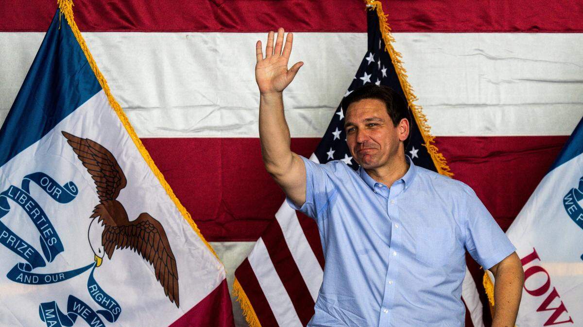Gov. Ron DeSantis waves to an audience during a salute-to-the-troops fundraising event on July 15 in Ankeny, Iowa.