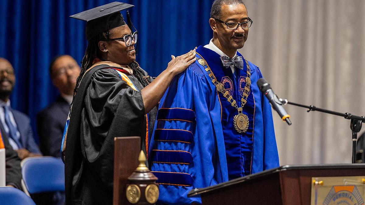 Trustee Deneshea L. Phelps Owens presents Dr. Jaffus Hardrick, Ed.D., with the presidential elements during his investiture ceremony as the 14th president of Florida Memorial University, celebrated at the university’s campus in Miami Gardens, on Friday, March 17, 2023.