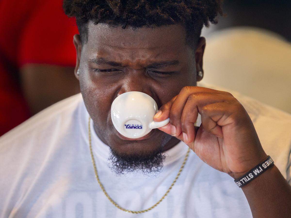 Miami Dolphins’ defensive tackle Jamiyus Pittman (65) reacts after drinking Cuban coffee at Versailles in Little Havana during the team’s Football Unites: Cultural Tours event on Tuesday, September 18, 2018. The event unites Miami Dolphins players, alumni and staff with community leaders and law enforcement to experience the cultural diversity of South Florida.