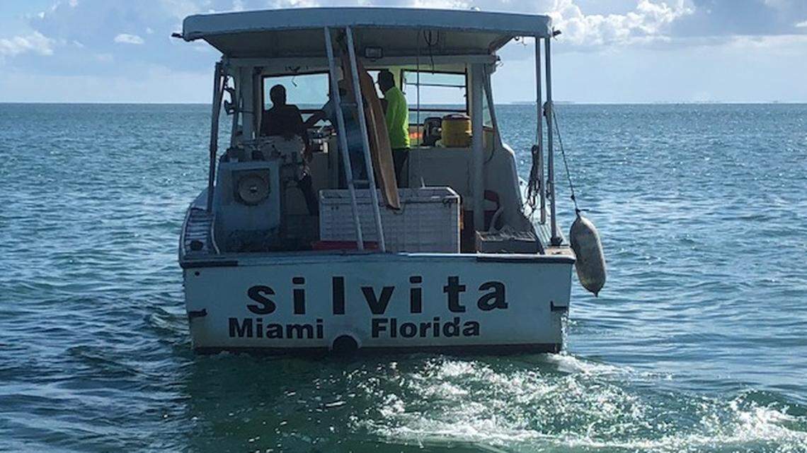 The owner of a 34-foot fishing boat surrendered it to federal officials on Monday after the boat captain was found poaching nearly 300 lobsters and stone crabs last summer in Biscayne National Park.