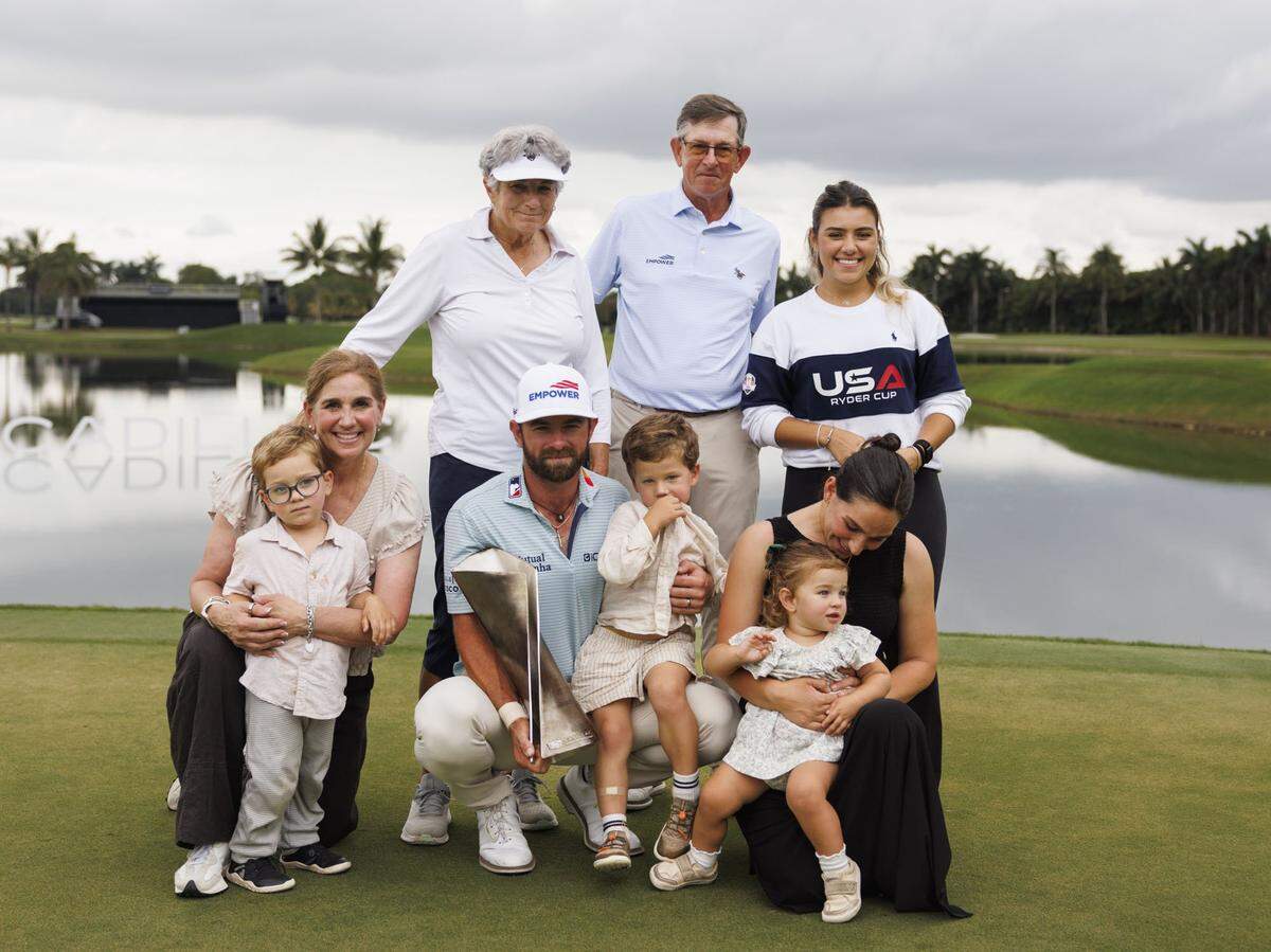 Cameron Young poses with his family after winning the final round of the Cadillac Championship PGA Tour on Sunday, May 3, 2026, at Trump National Doral in Doral, Fla. 