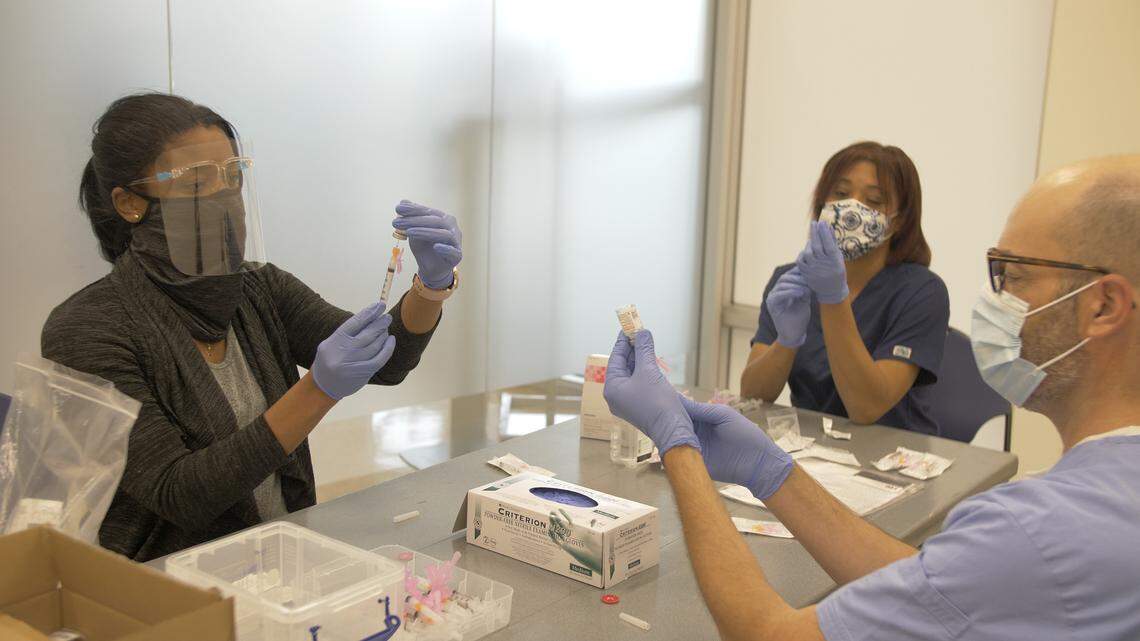 Dr. Charles Buscemi, a clinical associate professor and assistant chair of FIU’s graduate nursing program, volunteered to be one of the clinicians injecting FIU faculty and staff 65 and older Wednesday with the first dose of Moderna’s COVID-19 vaccine.