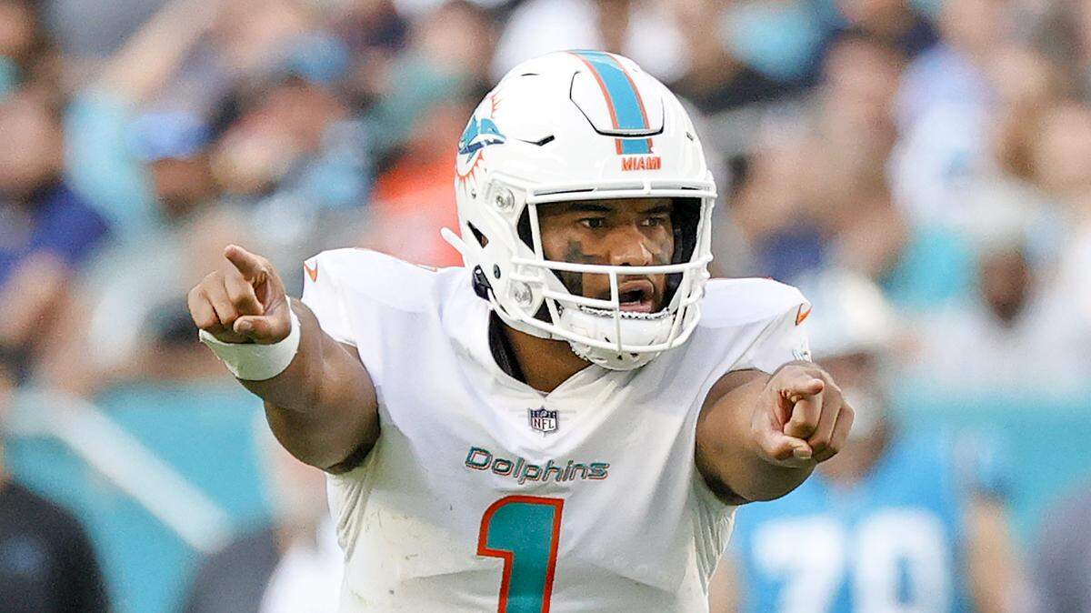 Miami Dolphins quarterback Tua Tagovailoa (1) calls a play during the fourth quarter of an NFL football game against the Carolina Panthers at Hard Rock Stadium on Sunday, November 28, 2021 in Miami Gardens, Florida.