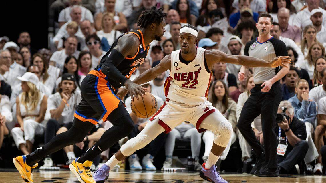 Miami Heat forward Jimmy Butler (22) defends as New York Knicks forward Julius Randle (30) drives the ball in the second quarter of Game 4 of the NBA Eastern Conference Semifinals at the Kaseya Center in Miami on Monday, May 8, 2023.