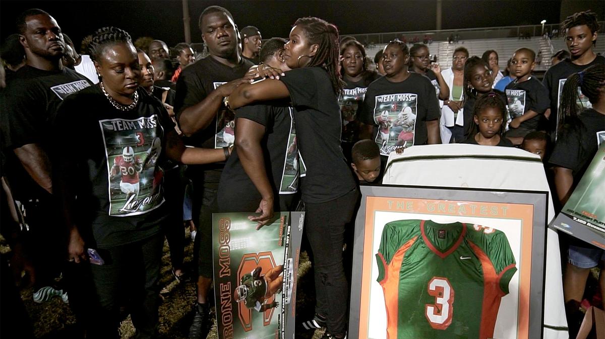 Family, teammates and friends of Blanche Ely High School football standout Tyrone Moss retire his Ely jersey, Friday, August 31, 2018, during halftime of the Tigers game against Plantation.