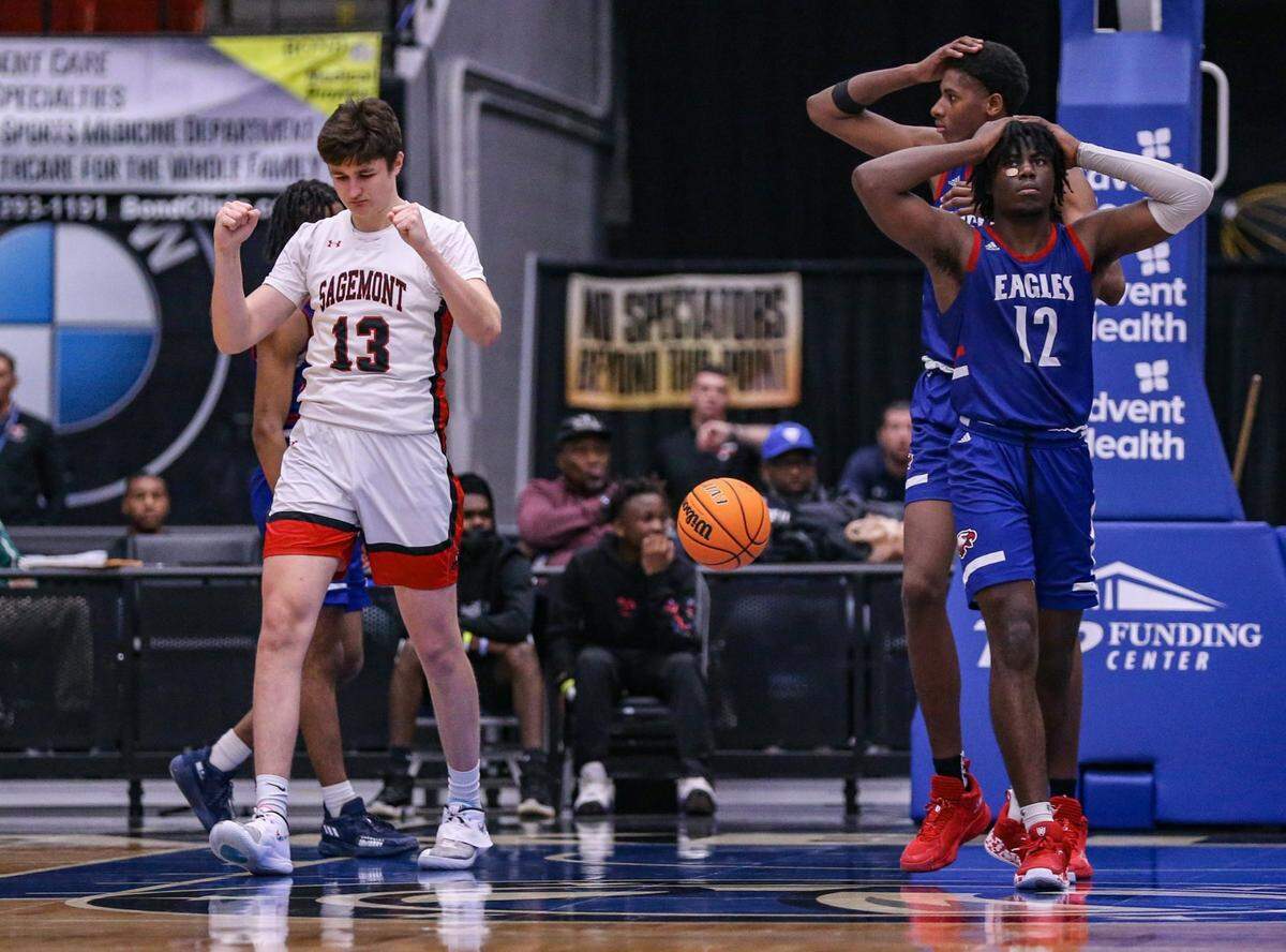 Sagemonts Nedas Zukaukas (13) pumps his fists as Sagemont leads late in the fourth quarter as North Florida Educational Miyake Oshidon (12) and Melian Martinez (21) react in the Class 2A boys basketball semifinal at the RP Funding Center in Lakeland on Wednesday, March 2, 2022.