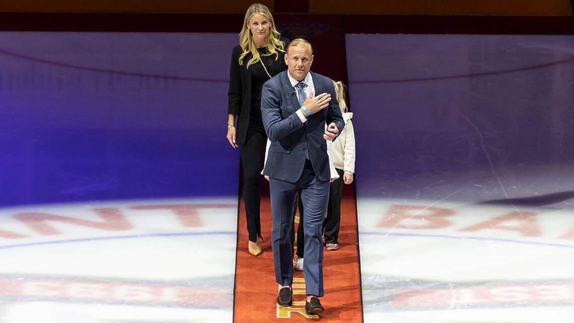Former Florida Panthers player Patric Hornqvist, accompanied by his family, reacts during his retirement ceremony before the start of an NHL game between the Florida Panthers and the Pittsburgh Penguins at the Amerant Bank Arena on Friday, Dec. 8, 2023, in Sunrise, Fla.