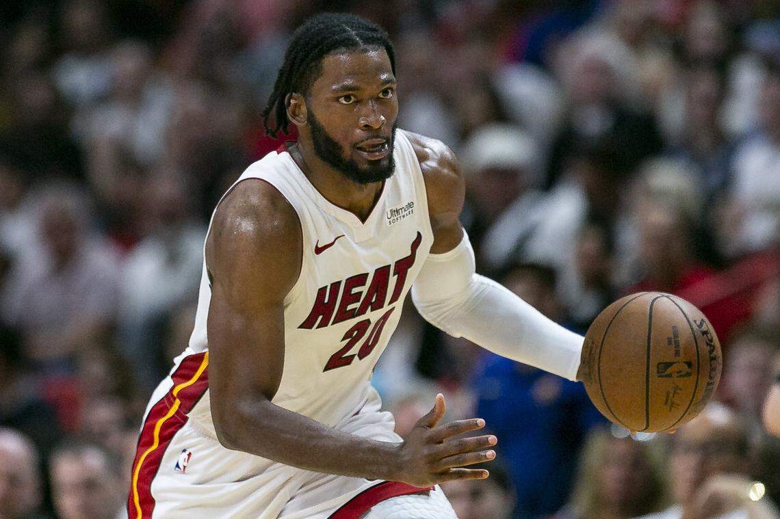 Miami Heat forward Justise Winslow (20) drives the ball down the court against Toronto Raptors during the second quarter of an NBA basketball game at the AmericanAirlines Arena on Sunday, March 10, 2019.