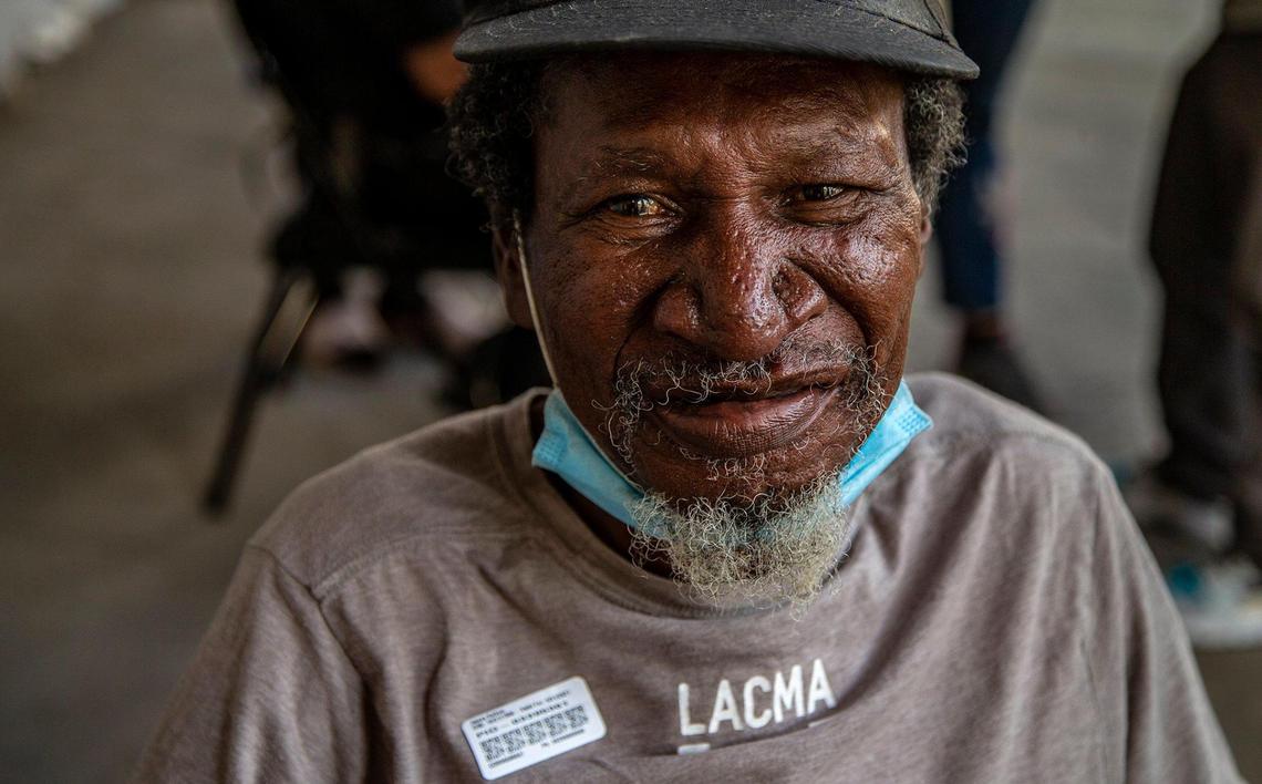 James Kellom, a homeless man who said he has been living in the street for almost 40 years in downtown Miami, reacts after being vaccinated. The Miami-Dade County Homeless Trust is teaming up with the Florida Division of Emergency Management to conduct vaccination tours throughout homeless hot spots and shelters across Miami-Dade.