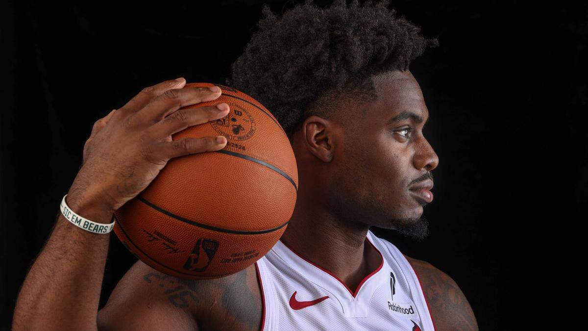 Heat guard Davion Mitchell sits for a quick photo session at Miami Heat Media Day inside the practice court at Kaseya Center in Miami on September 29, 2025.