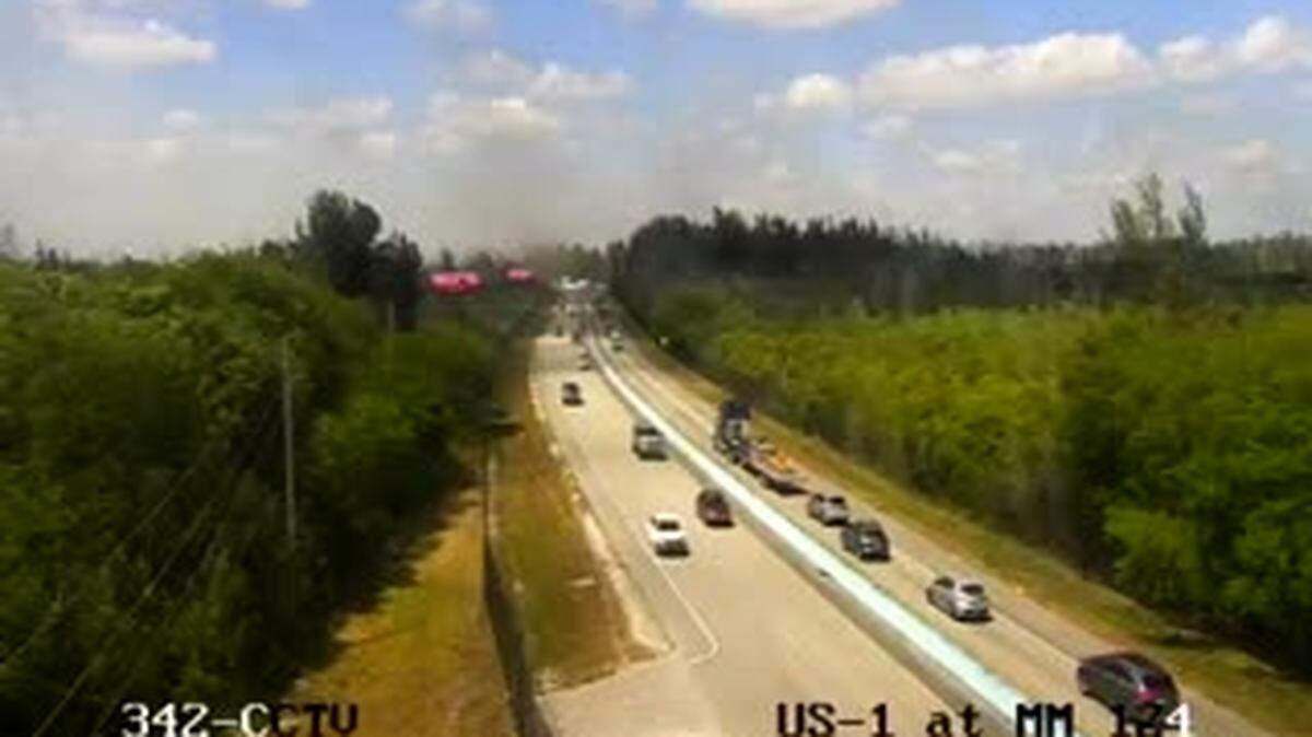 A Florida Department of Transportation highway camera shows smoke in the distance in the southbound lanes of the 18 Mile Stretch of U.S. 1 heading into the Florida Keys Friday, April 9, 2021.