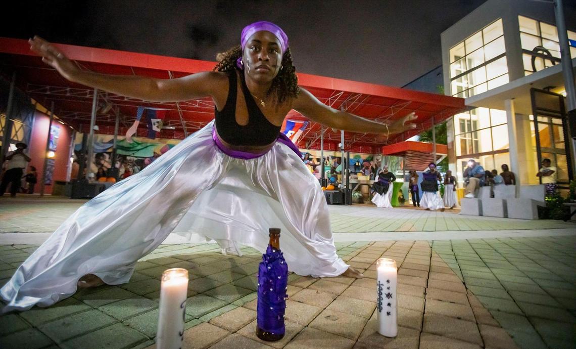 Fabiola Registre, a dancer with the NSL Danse Ensemble, performs a traditional Haitian dance in honor of Day of the Dead at the Little Haiti Cultural Complex.