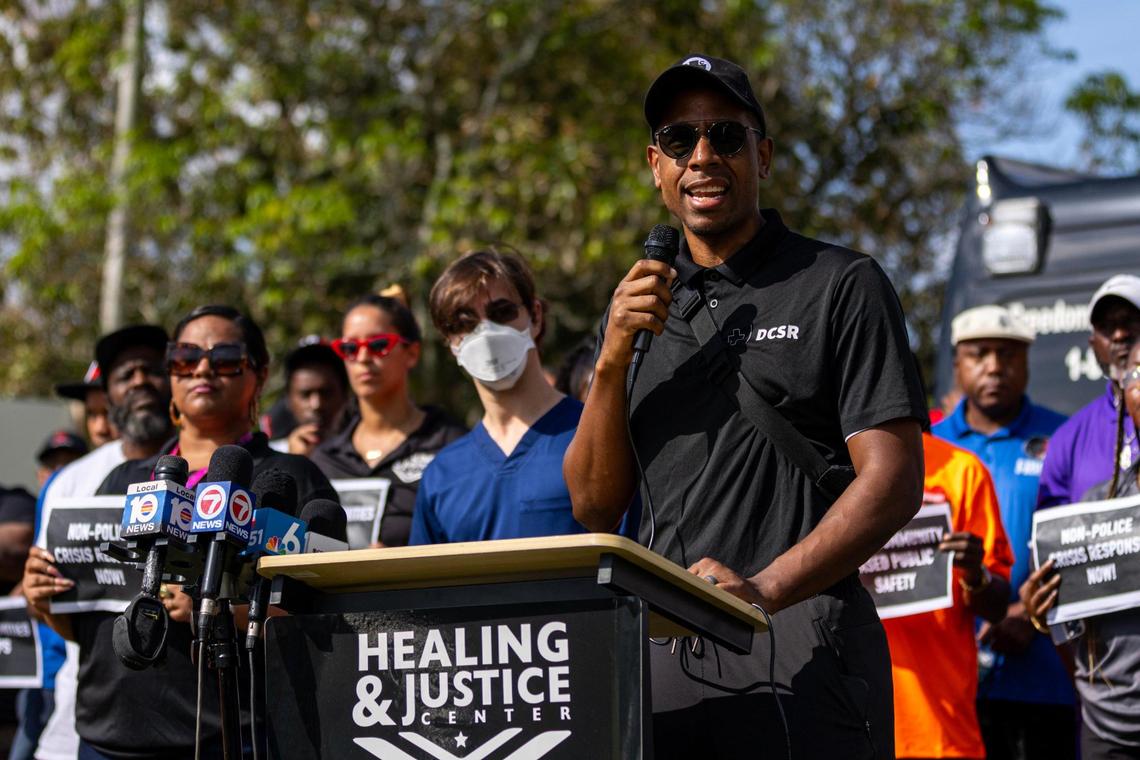Healing and Justice Center Medical Director Dr. Armen Henderson speaks during a press conference last week across the street from the scene of a shooting in which a Miami Police officer shot a man in distress on his front porch multiple times.