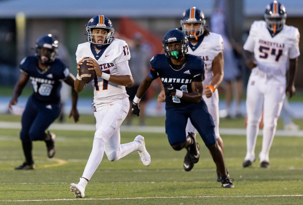 Homestead Broncos quarterback Malachi Lewis (17) runs with the ball in the first half of his football game against the Palmetto Panthers at Tropical Park on Friday, Aug. 23, 2024, in Miami, Fla.